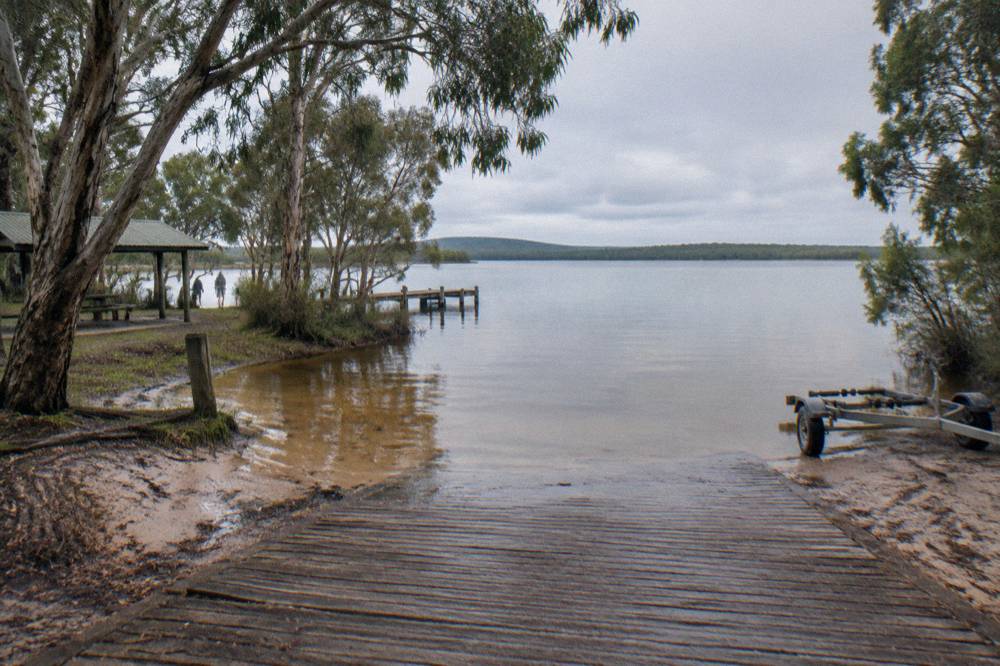 Boat ramp and still lake water at a Boreen Point departure point