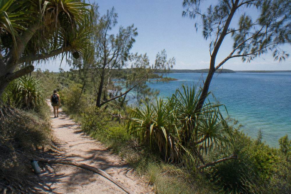 Coastal headland track above turquoise water with headland views